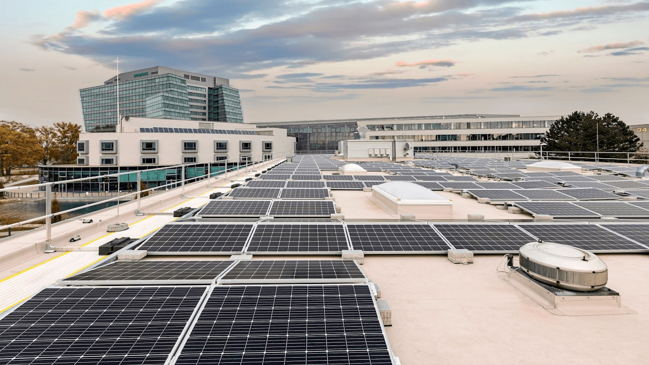 A Siemens Microgrid system with solar panels and batteries installed on a rooftop.